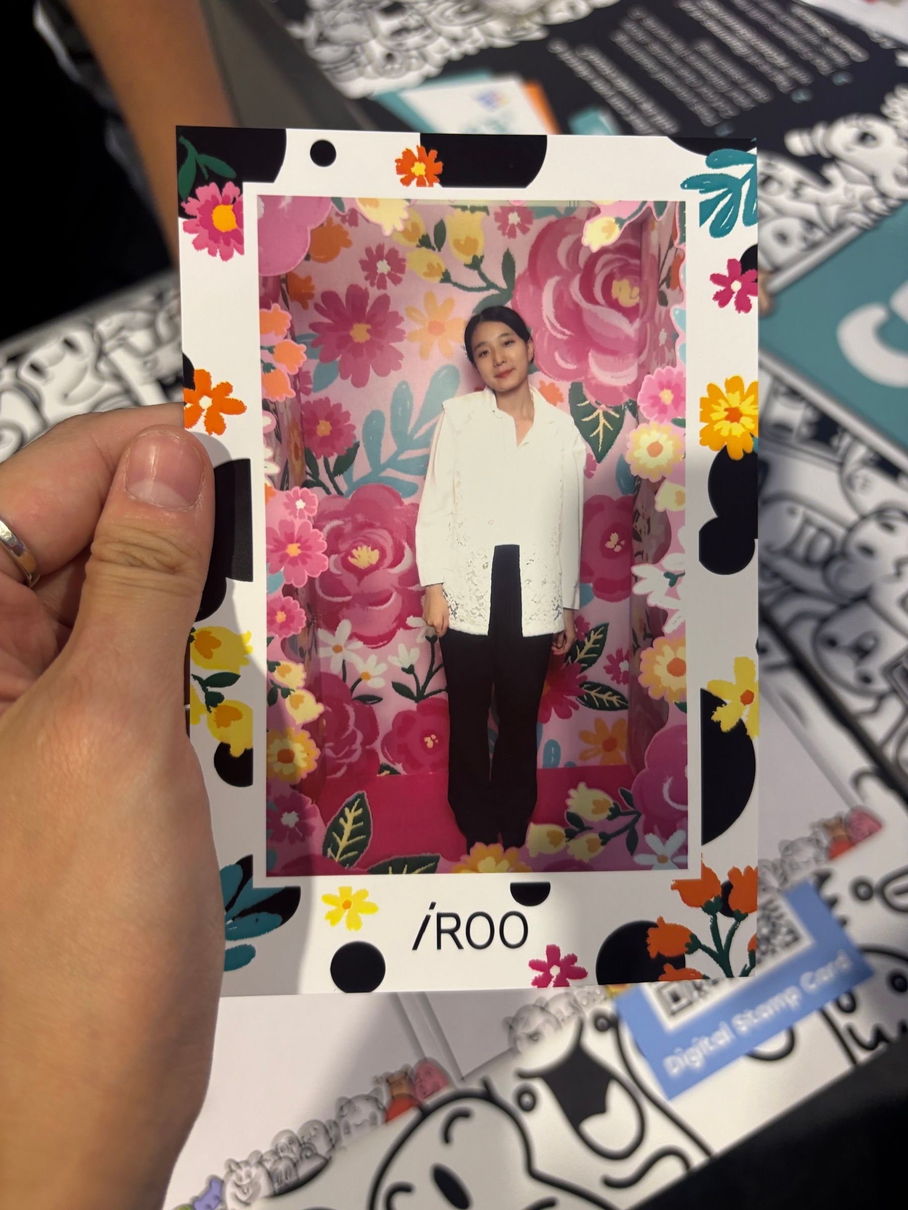 Every visit ended in the hand: instant prints in the campaign's polka-dot frames